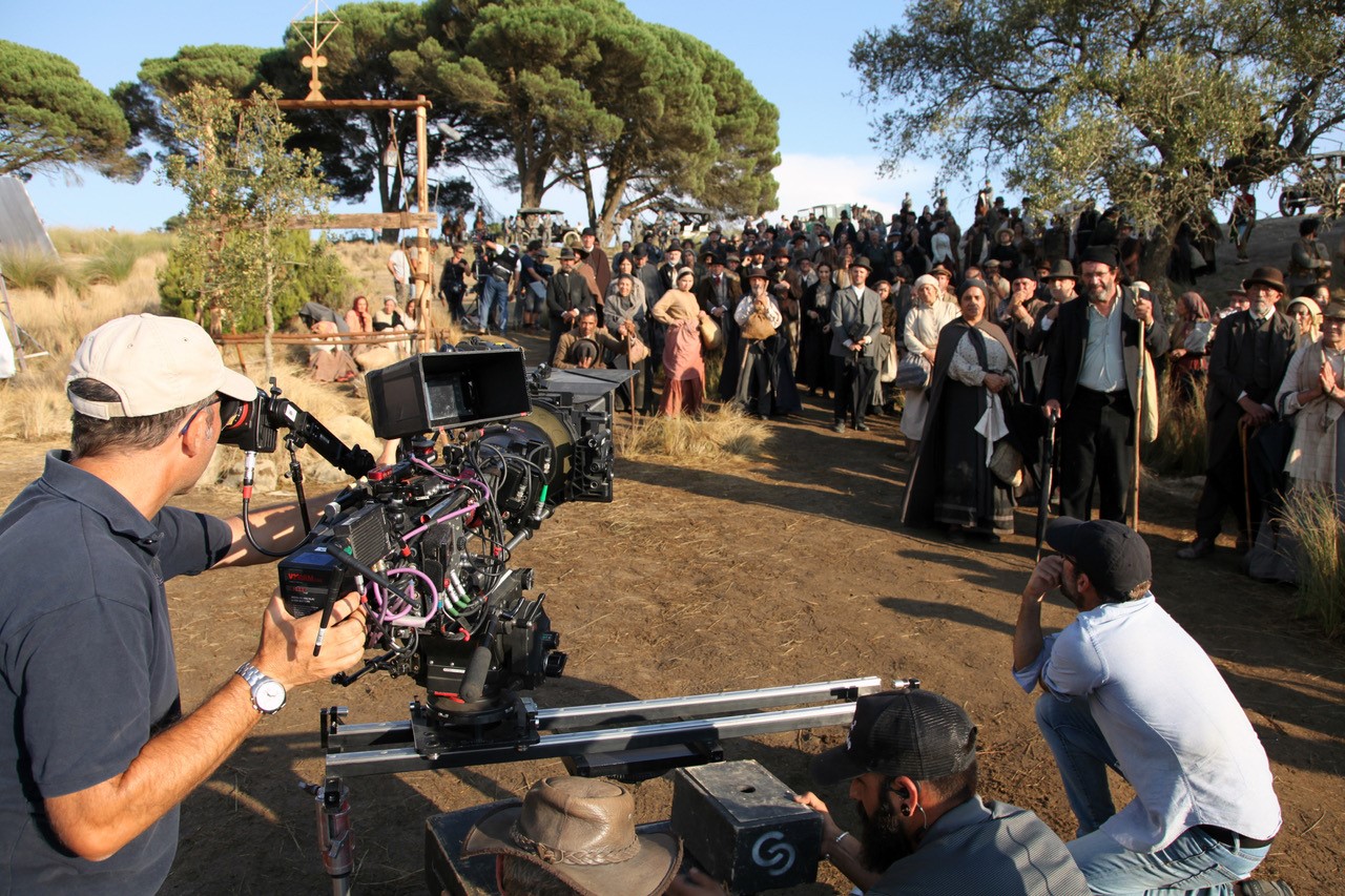 Person filming documentary scene